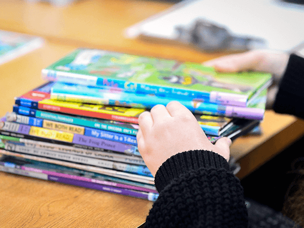 Small hands holding a children;'s book