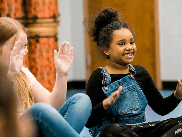 Two little girls dancing