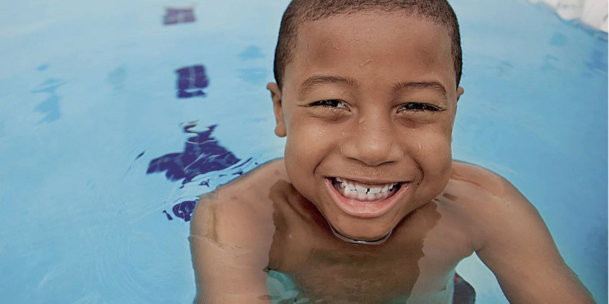 smiling boy in pool